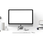 silver imac near white ceramic kettle